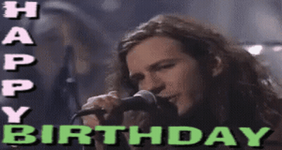 A Man Singing Into A Microphone With The Words Happy Birthday Written Above Him GIF