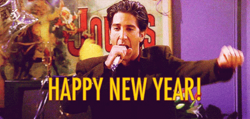 A Man Singing Into A Microphone With The Words Happy New Year Written Below Him GIF