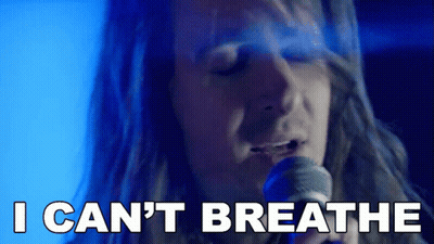 A Man Singing Into A Microphone With The Words " I Can 'T Breathe " Next To Him GIF
