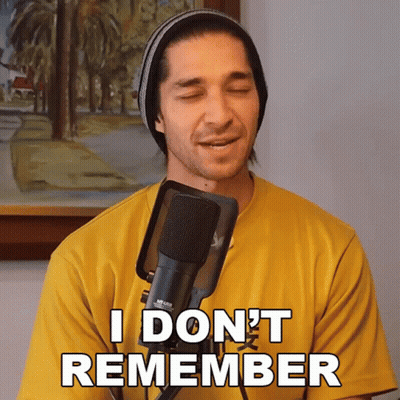 A Man Singing Into A Microphone With The Words " I Don 'T Remember " Written On His Shirt GIF