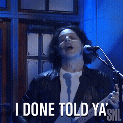 A Man Singing Into A Microphone With The Words I Done Told Ya ' Snl Behind Him GIF