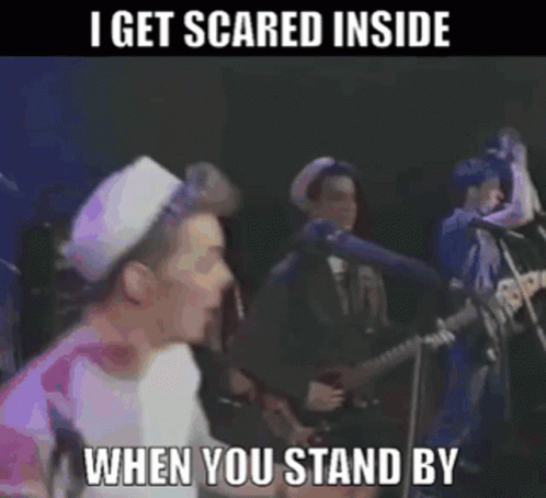 A Man Singing Into A Microphone With The Words I Get Scared Inside When You Stand By Below Him GIF