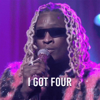 A Man Singing Into A Microphone With The Words " I Got Four " Above Him GIF