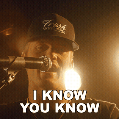 A Man Singing Into A Microphone With The Words I Know You Know Above Him GIF