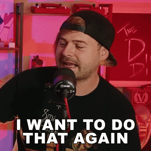 A Man Singing Into A Microphone With The Words I Want To Do That Again Below Him GIF