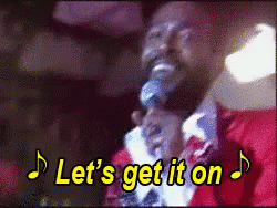 A Man Singing Into A Microphone With The Words Let 'S Get It On Written Above Him GIF