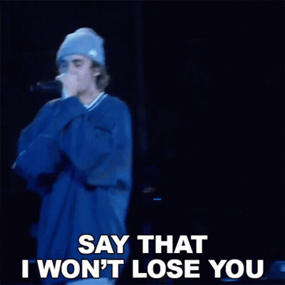 A Man Singing Into A Microphone With The Words Say That I Won 'T Lose You GIF
