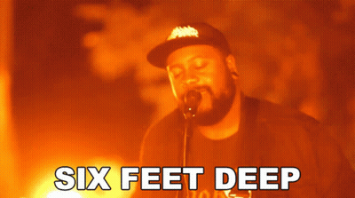 A Man Singing Into A Microphone With The Words Six Feet Deep Written Below Him GIF
