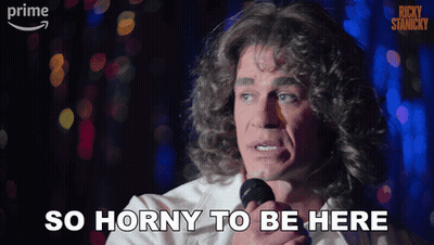 A Man Singing Into A Microphone With The Words So Horny To Be Here GIF