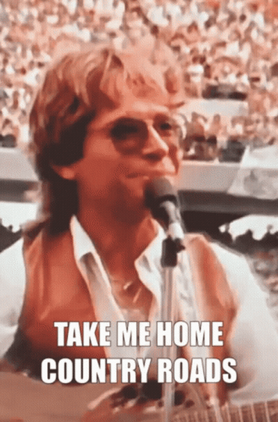 A Man Singing Into A Microphone With The Words Take Me Home Country Roads GIF