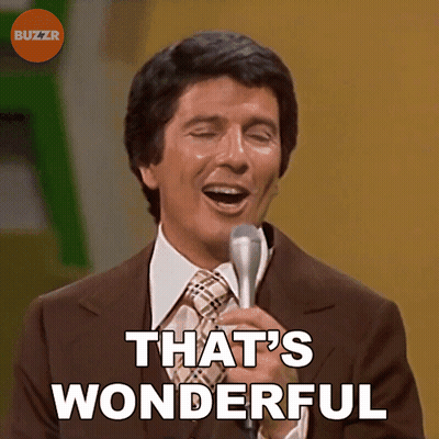 A Man Singing Into A Microphone With The Words That 'S Wonderful Above Him GIF