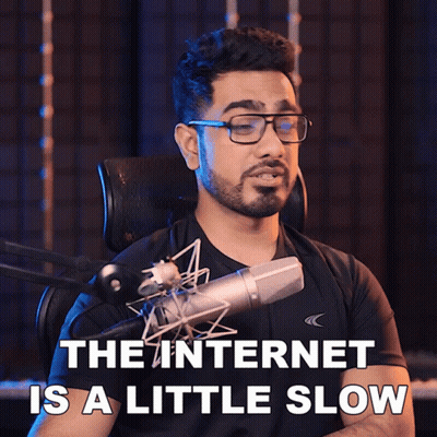 A Man Singing Into A Microphone With The Words " The Internet Is A Little Slow " Behind Him GIF