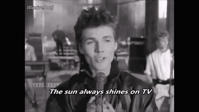 A Man Singing Into A Microphone With The Words The Sun Always Shines On Tv GIF