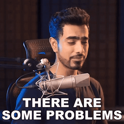 A Man Singing Into A Microphone With The Words " There Are Some Problems " Behind Him GIF