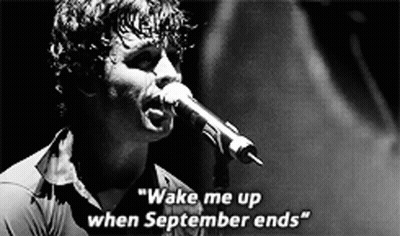 A Man Singing Into A Microphone With The Words " Wake Me Up When September Ends " On The Bottom GIF