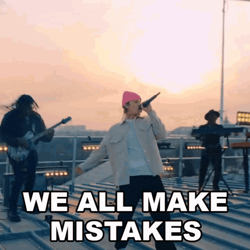 A Man Singing Into A Microphone With The Words " We All Make Mistakes " Above Him GIF
