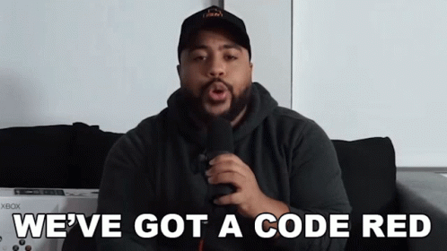 A Man Singing Into A Microphone With The Words We 'Ve Got A Code Red Above Him GIF