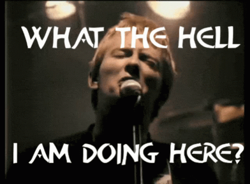 A Man Singing Into A Microphone With The Words " What The Hell I Am Doing Here " Above Him GIF