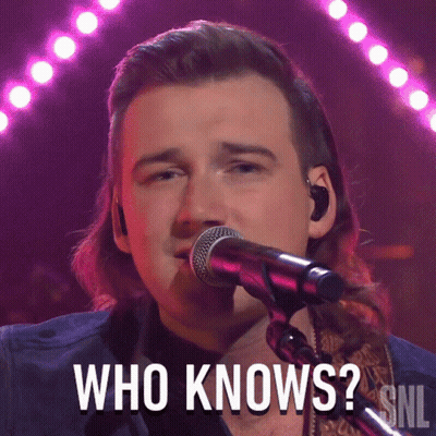 A Man Singing Into A Microphone With The Words Who Knows Above Him GIF