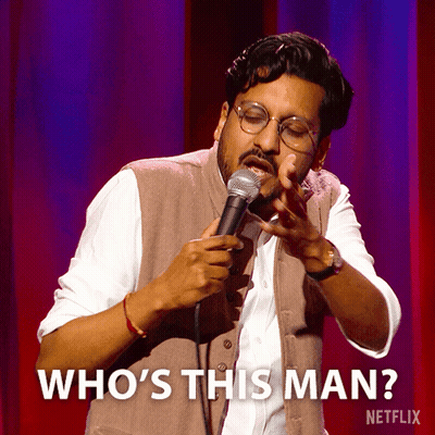 A Man Singing Into A Microphone With The Words Who 'S This Man On The Bottom GIF