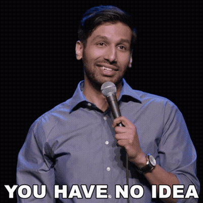 A Man Singing Into A Microphone With The Words " You Have No Idea " Above Him GIF