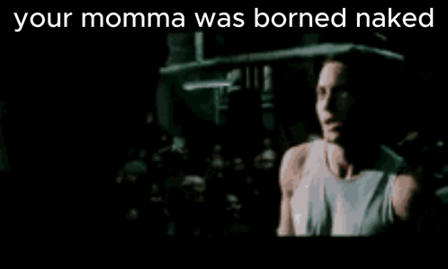 A Man Singing Into A Microphone With The Words " Your Momma Was Borned Naked " Above Him GIF