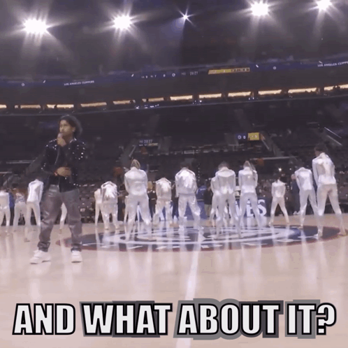 A Man Singing On A Basketball Court With The Words And What About It GIF
