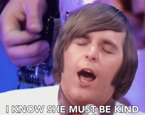 A Man Singing With The Words " I Know She Must Be Kind " Above Him GIF