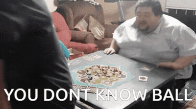 A Man Sits At A Table Playing A Board Game With The Words " You Dont Know Ball " Written Above Him GIF