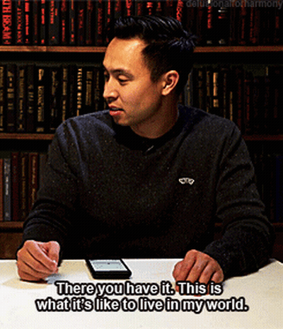 A Man Sits At A Table With A Cell Phone And Says There You Have It GIF