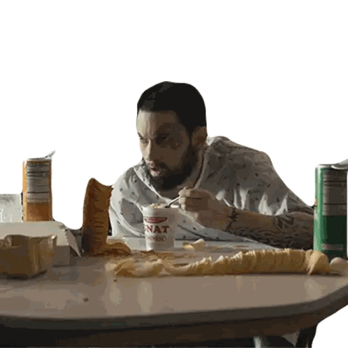 A Man Sits At A Table With A Cup Of Nat Noodle Soup Sticker