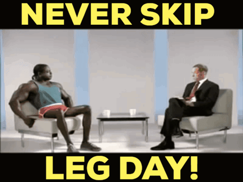 A Man Sits In A Chair Talking To Another Man With The Words Never Skip Leg Day GIF