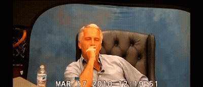 A Man Sits In A Chair With A Bottle Of Water And The Date Mar 17 2010 GIF