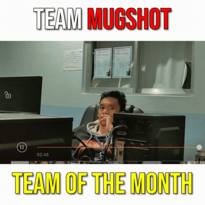 A Man Sits In Front Of A Computer Screen With The Words Team Mugshot Team Of The Month GIF