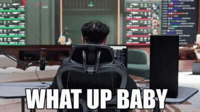 A Man Sits In Front Of A Computer Screen With The Words What Up Baby Written On The Bottom GIF