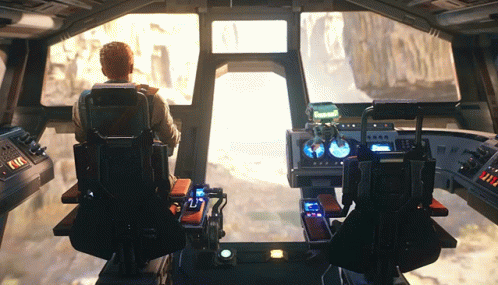 A Man Sits In The Cockpit Of A Space Ship With The Letters Tcl On The Control Panel GIF