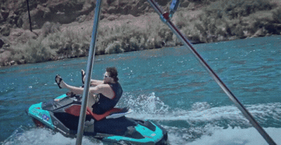 A Man Sits On A Jet Ski That Says ' Jet Ski ' On The Side GIF