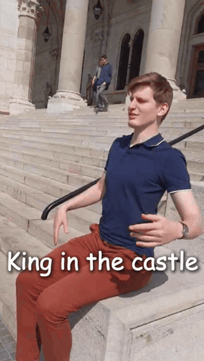 A Man Sits On A Set Of Stairs With The Words King In The Castle Written Below Him GIF