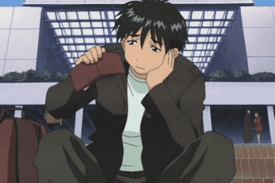 A Man Sits On The Ground Holding His Wallet GIF