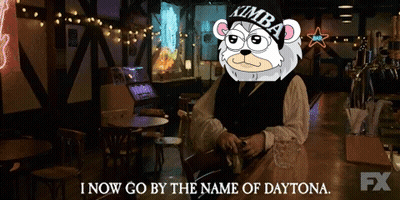 A Man Sitting At A Bar With A Kimba Bear On His Head Says I Now Go By The Name Of Daytona GIF