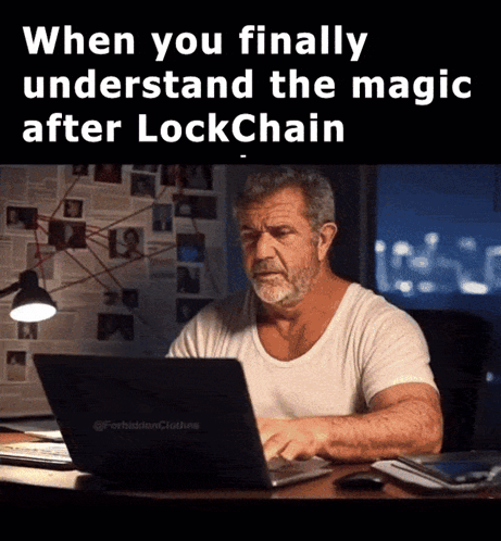 A Man Sitting At A Desk With A Laptop And The Words When You Finally Understand The Magic After Lockchain GIF