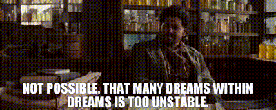 A Man Sitting At A Desk With A Quote That Says Not Possible That Many Dreams Within Dreams Is Too Unstable GIF