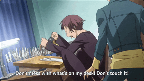 A Man Sitting At A Desk With The Words " Do N't Mess With What 'S On My Desk " Written Below Him GIF
