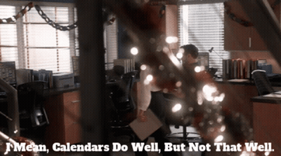 A Man Sitting At A Desk With The Words Mean Calendars Do Well But Not That Well GIF