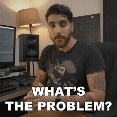 A Man Sitting At A Desk With The Words " What 'S The Problem " Written Above Him GIF