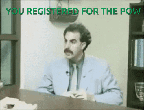 A Man Sitting At A Desk With The Words You Registered For The Pow GIF