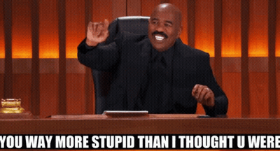 A Man Sitting At A Desk With The Words " You Way More Stupid Than I Thought U Were " Above Him GIF