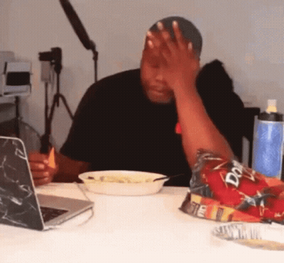 A Man Sitting At A Table With A Bag Of Doritos In Front Of Him GIF