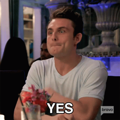A Man Sitting At A Table With A Bravo Logo On His Speech Bubble GIF