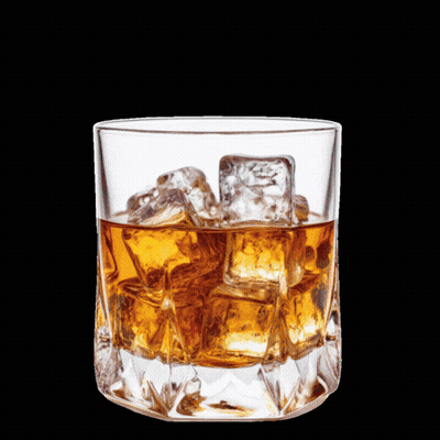 A Man Sitting At A Table With A Glass Of Whiskey And A Prayer GIF